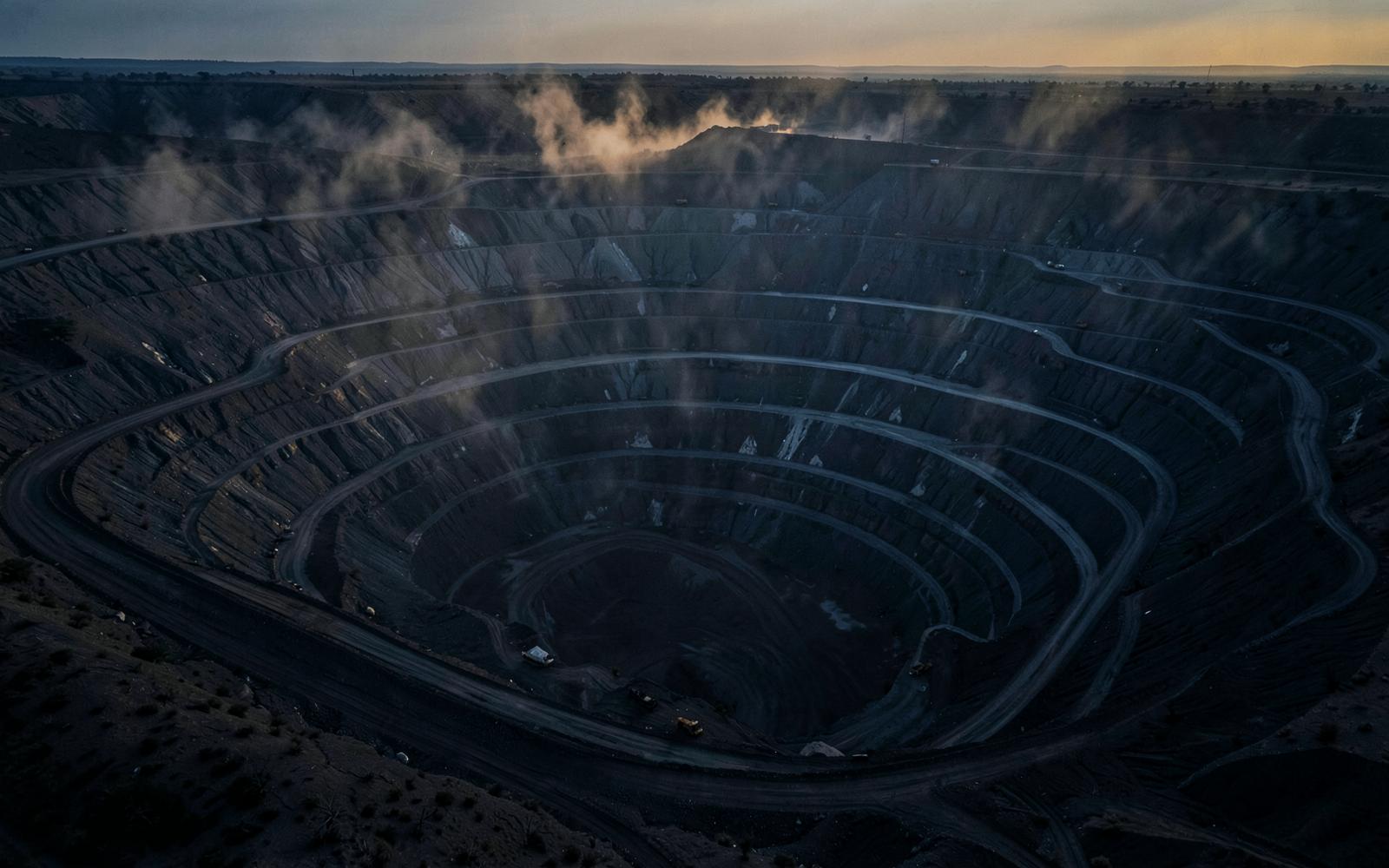 Open-pit mining operation where site-based practitioners work